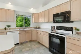 The kitchen sink window overlooks the fully fenced back yard.