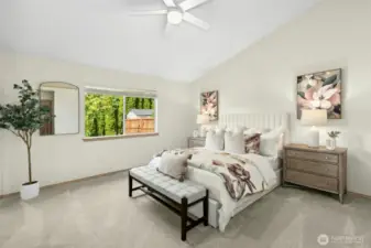 Beautiful primary bedroom with vaulted ceilings, again with fresh paint and new carpeting!