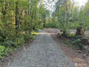 Private drive leads to your already cleared building site.