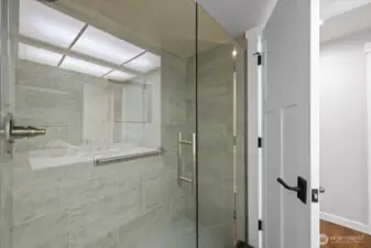 Glass-surround shower in the Guest bath is beautiful and modern.