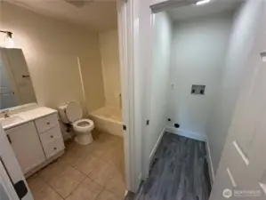 Laundry space and bathroom