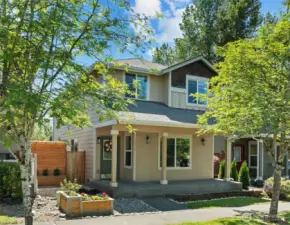 Situated on a peaceful tree lined street w/ covered front patio.