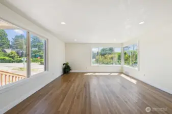 Bright large living room with conner glass window