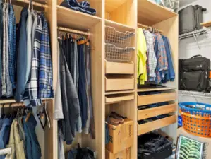 Primary walk-in closet with custom organization