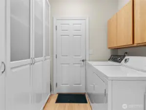 Laundry room with sink and ample storage