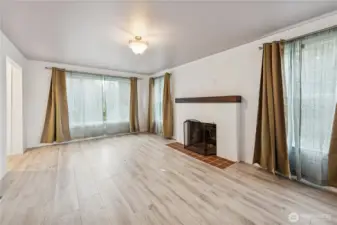 Living room with wood-burning fireplace.
