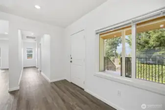 Looking down the hall toward laundry, guest bed and guest bath.