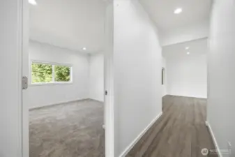 Guest bed looking down the hall to Living room