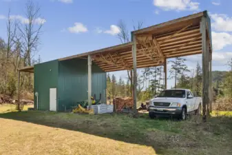 Pole Barn has a 12 by 30 enclosed area, with it’s own power box and meter, along with tall covered areas measuring 60 by 30. Perfect for storing boat, RV, other toys and outdoor equipment. Two posts need to be repaired on the north end, seller has estimate for the replacement cost. Water and Electrical is in place for upgraded RV parking!