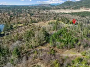 Home has access to a private lake that has 9 adjourning properties. No public access. As you come down the driveway onto the property, you will see a little "trail" sign at the bottom of the hill and that will take you to about 100' of waterfront along the lake that is on this property. While it's pretty simple right now, with a trail down to the water w/some cleared area, it could potentially be made into more.