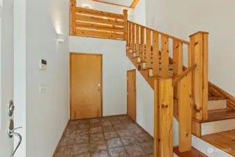 Main floor entry with open rail staircase.