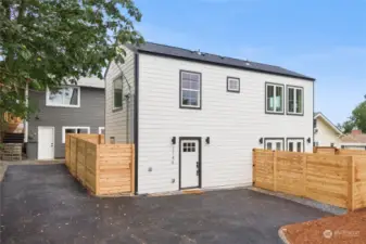 Designated parking spot in paved area in front of the house