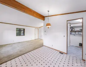 New kitchen flooring. Laundry/utility room off of kitchen. Door to outdoor patio in laundry/utility.