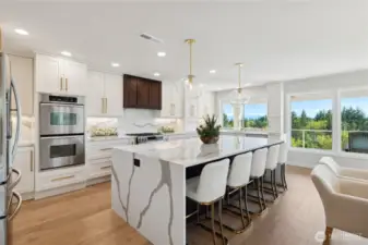 New professionally designed gourmet kitchen with custom cabinets, drawers and pull-outs. Solid slab granite and back splashes. Double ovens, six burner gas stove, drawer microwave, French doors to huge entertainment deck.