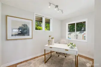 This second bedroom is being used as a Home Office.  There is a closet on the right.  This bedroom is across from the Primary suite.  If you look closely, you will see part of the Mediterranean inspired, private flowering gardens.