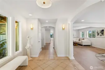 This view is from the double glass front doors.  There's a coat closet down the hallway on the left and a built-in shoe storage cabinet on the right.