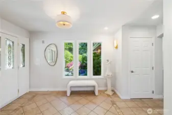 The front double door entrance is on the left; there's a large garage and storage room just outside the door.  That window looks out to the Lush Mediterranean Gardens, Water Fountains and Private Sitting areas.