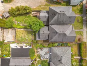 This bird's eye view showcases the spacious back yard and parking for this property.
