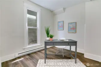 Bright and inviting, this bedroom features a large window that fills the space with natural light. With two closets, there's plenty of storage to keep everything organized.