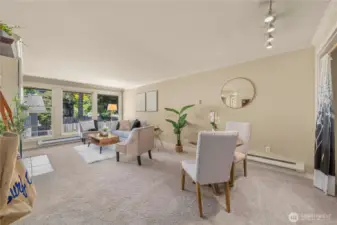 The living and dining areas flow perfectly into each other while offer space for both areas to coexist