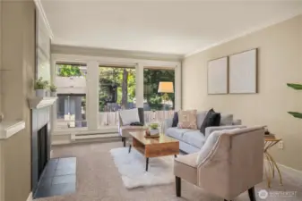 Large windows in the living room fill this home with natural light
