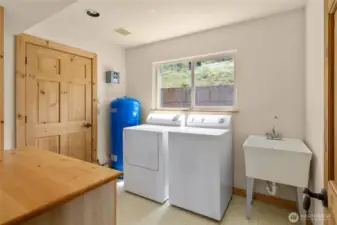 Laundry room with utility sink.
