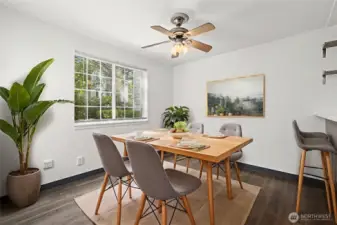 Sun-drenched dining area with convenient counter-height seating—perfect for casual meals or entertaining.