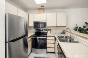 Functional kitchen with skylight and brand new appliances.
