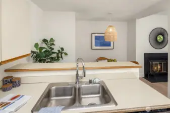 View to the dining area and fireplace.