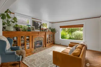 Natural light floods into living area with custom built in