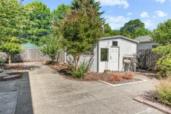 Fully fenced backyard with 2 outbuildings