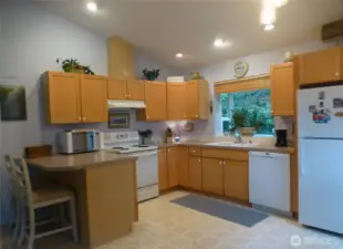 Spacious kitchen with ample storage and counter space.