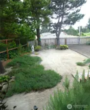 View from front kitchen window to easy care front yard.