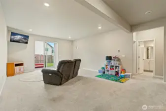 Large lower family room or playroom with outside access