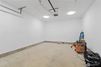 finished, attached 1 car garage.