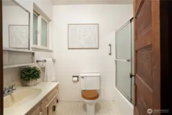 First bathroom with a tub/shower combo.