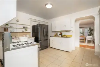 Gas range, and built-in shelving.