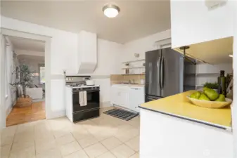 Past the kitchen is the dining area + second living space.