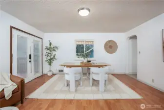 French doors open to the back deck and yard.