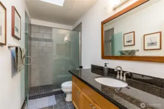 Hall bathroom upstairs with tiled step-in shower