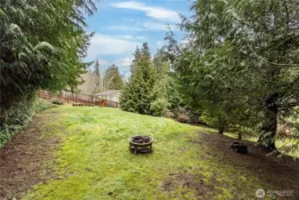 Serene and secluded space behind the main yard - a fantastic space for kids to play and explore, or gather a group of friends for a bonfire party!