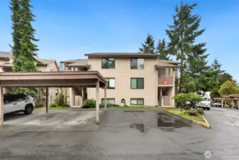 Top, end unit in Sunwood condos. Reserved, covered parking space, directly outside unit.