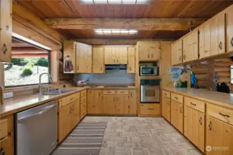 large kitchen with plenty of storage! pantry on the other side of cabinets. floor to ceiling
