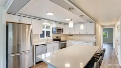 Remodeled kitchen with all stainless steel appliances, Quartz counter tops and new lighting.