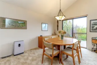 The dining area is spacious and convenient to the back deck and the kitchen.