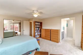 The walk in closet in the primary bedroom is to the left and the primary full bath is just ahead.