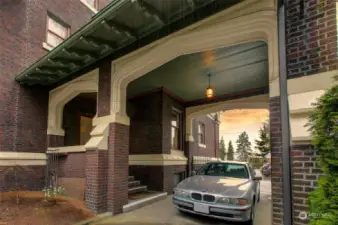 Covered parking in the porte cochere leading into the kitchen/mudroom.