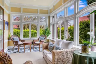 Light filled sunroom occupies the SW corner of the main floor.