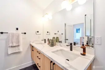 Double floating vanity and heated floors.