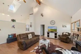 Soaring ceilings and a dormer window allow natural light to flood the main living area.